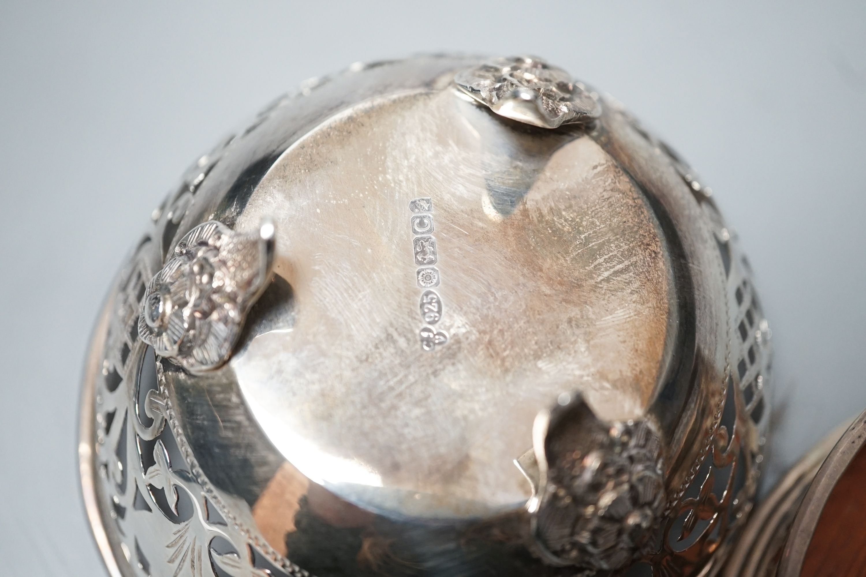 A modern pierced silver sweetmeat basket, 10cm and a similar pierced silver wine coaster.